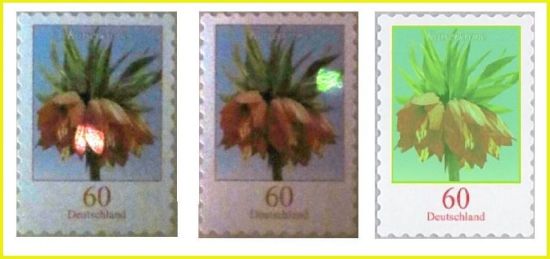 Die Prüfung der echten Marke an verschiedenen Stellen im Bereich der roten Blüte und der grünen Blätter sowie leicht grün überblendet, der Bereich, in dem man die Beimischung der seltenen Erden finden kann Die Prüfung der echten Marke an verschiedenen Stellen im Bereich der roten Blüte und der grünen Blätter sowie leicht grün überblendet, der Bereich, in dem man die Beimischung der seltenen Erden finden kann