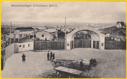 Bildseite einer Ansichtspostkarte vom Barackenlager in Puchheim - Eingangsbereich - aufgrund der vielen Baracken muss es sich um ein großes Lager gehandelt haben