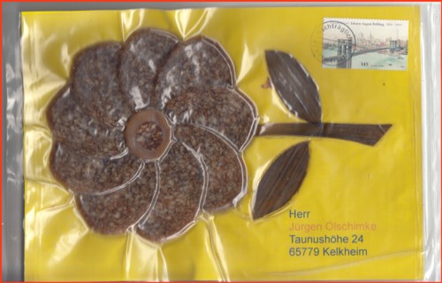 Die Anschriftenseite und gleichzeitig die Motivseite - eine Sonnenblume in Salamiform